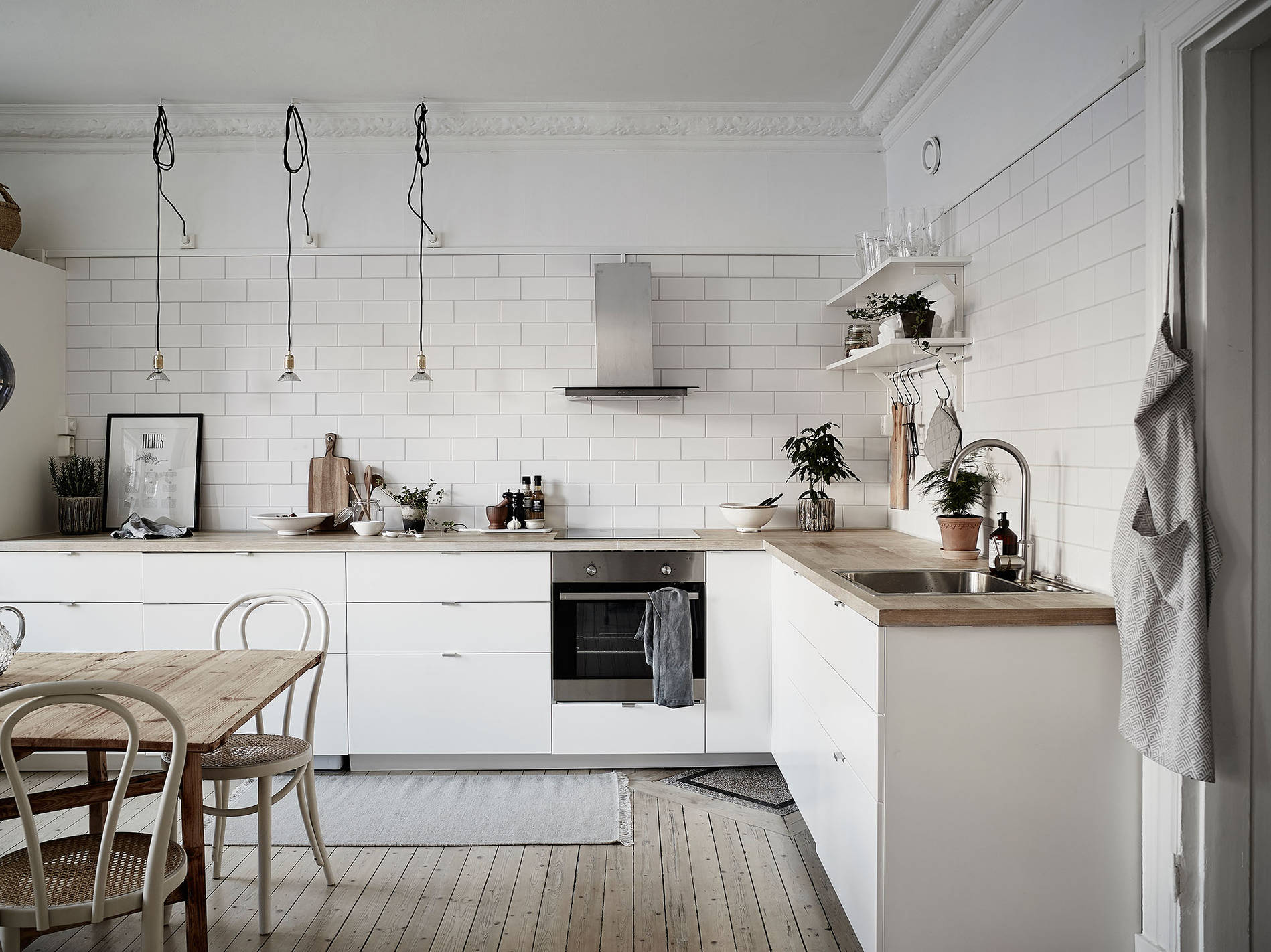 kitchen shelves over sink with white subway tile backsplash