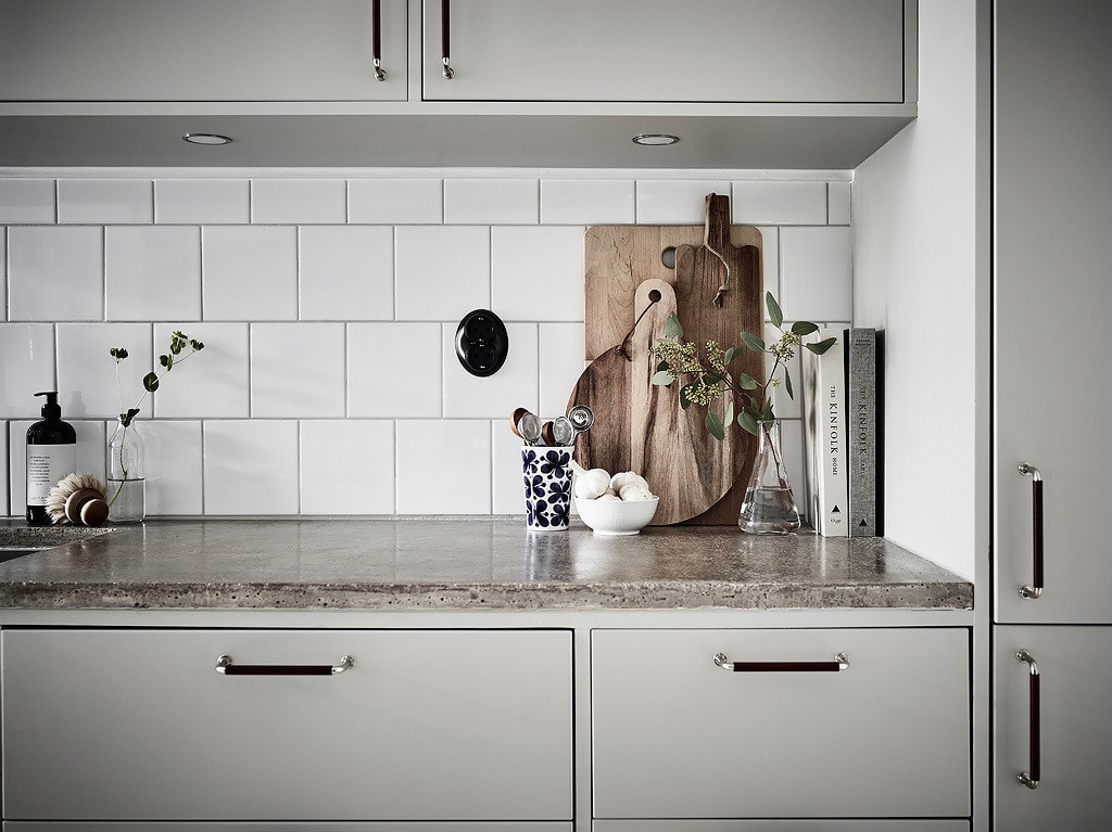 Off-white cabinets and concrete countertops