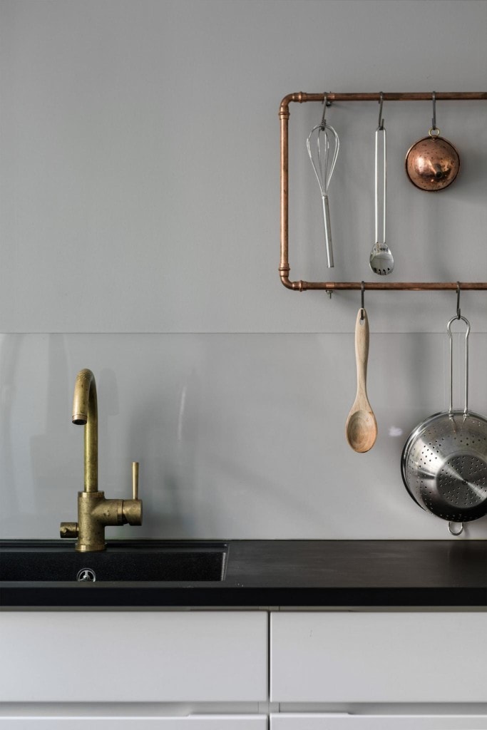 Kitchen with a copper rail - via Coco Lapine Design blog