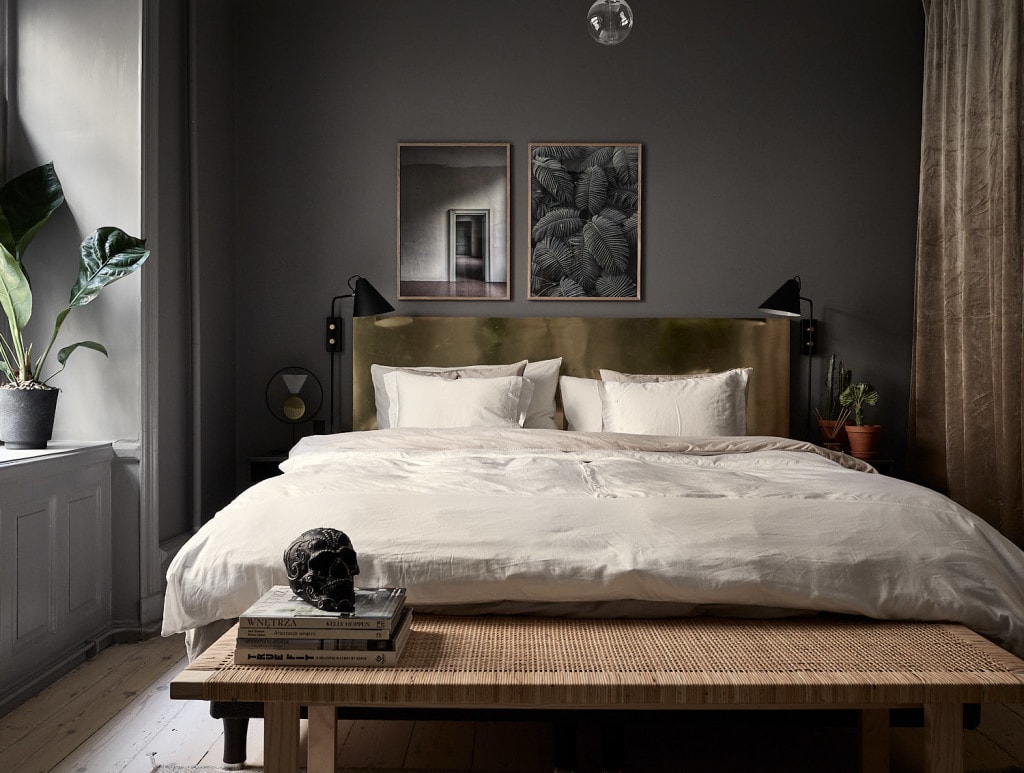 A moody grey bedroom enhanced with velvet fabrics