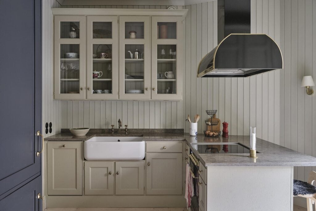 A greige farmhouse kitchen with shiplap walls