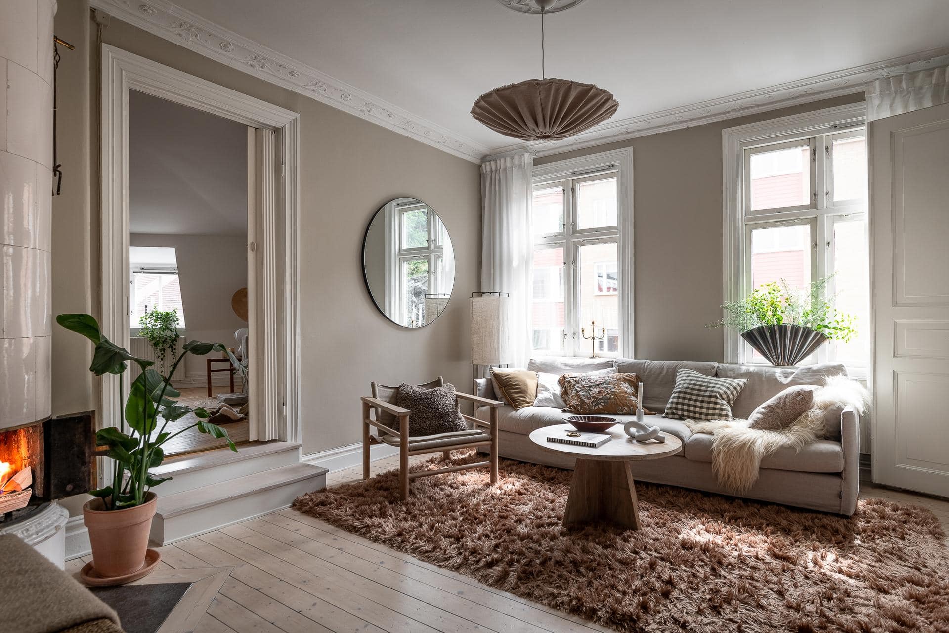 Grey kitchen cabinets against sage green walls in an attic apartment - COCO  LAPINE DESIGNCOCO LAPINE DESIGN