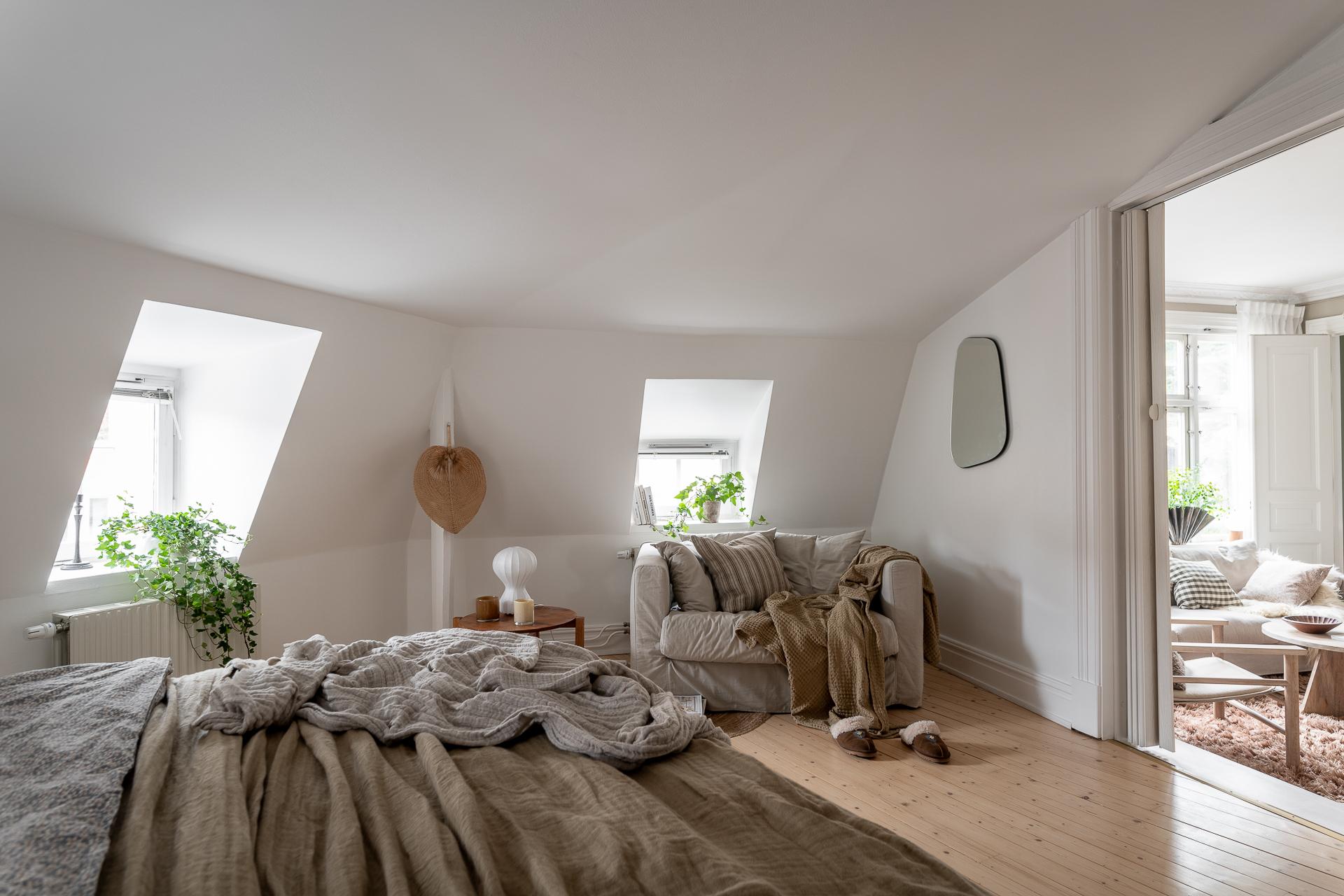 Grey kitchen cabinets against sage green walls in an attic apartment - COCO  LAPINE DESIGNCOCO LAPINE DESIGN