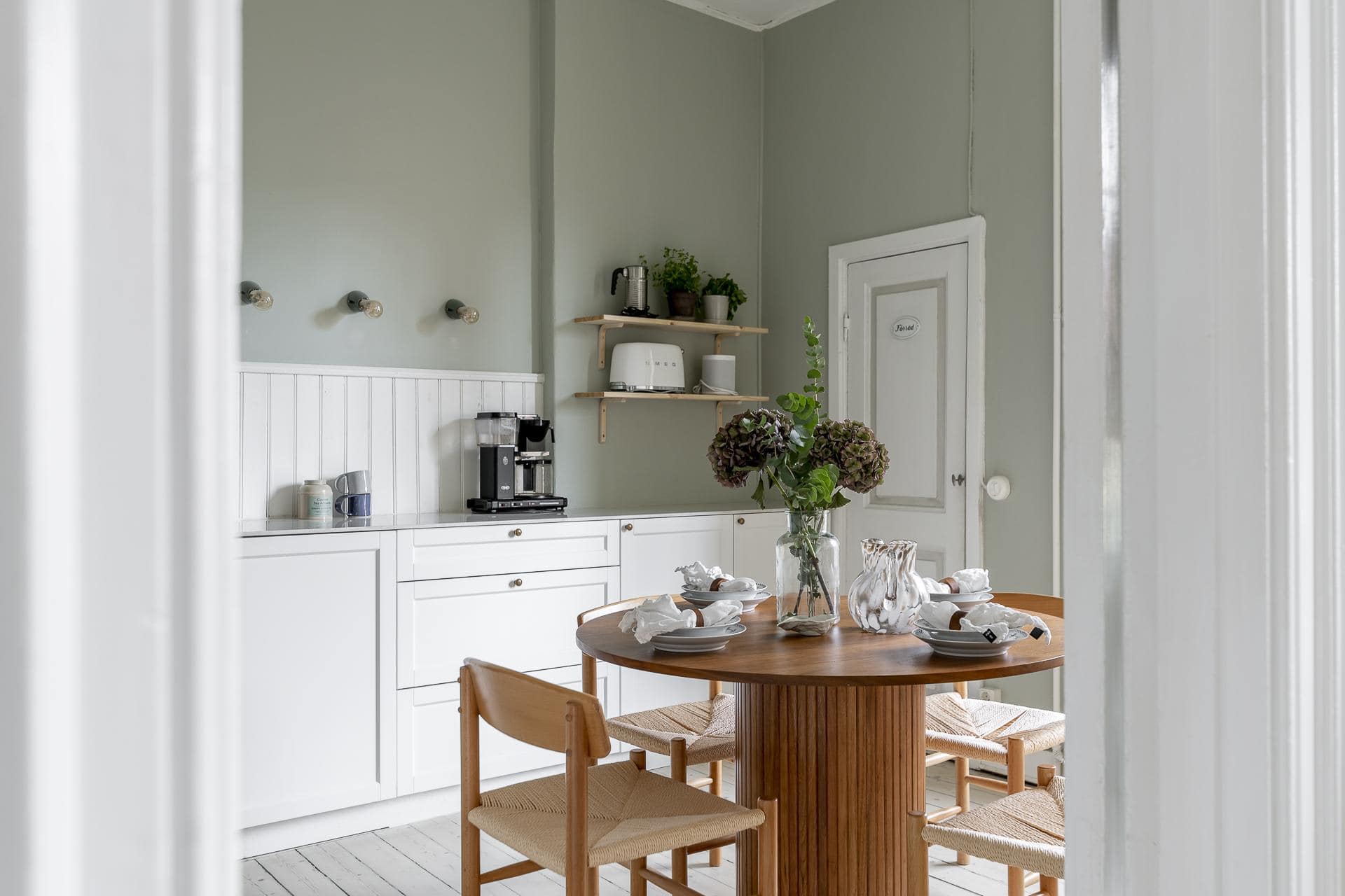 White Shaker Kitchen With A Shiplap Backsplash And Sage Green Walls COCO LAPINE DESIGNCOCO