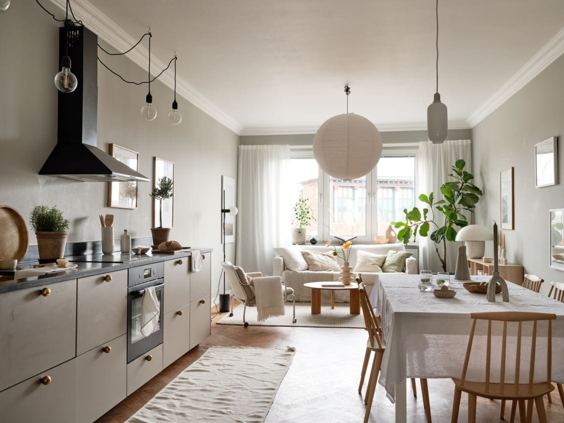 Sage green kitchen cabinets in a green color palette apartment - COCO  LAPINE DESIGNCOCO LAPINE DESIGN