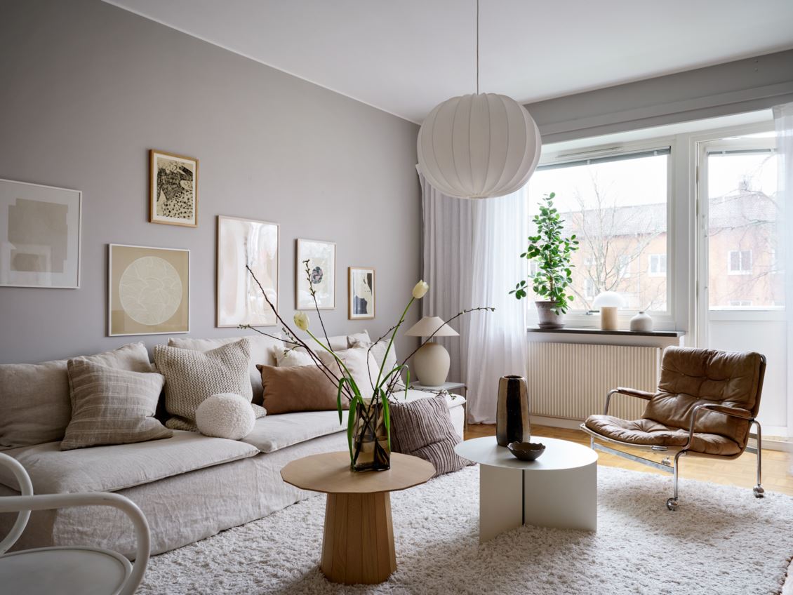 A Cozy Warm Grey Living Room And Blue
