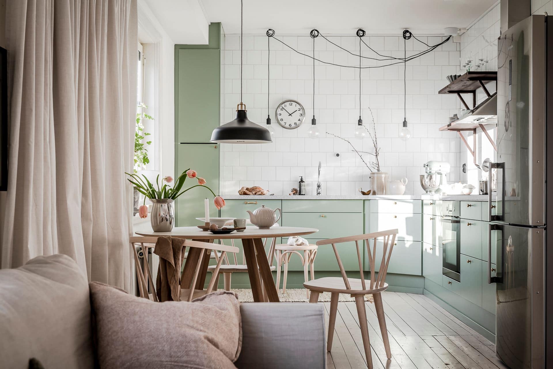 Sage green kitchen cabinets in a green color palette apartment - COCO  LAPINE DESIGNCOCO LAPINE DESIGN