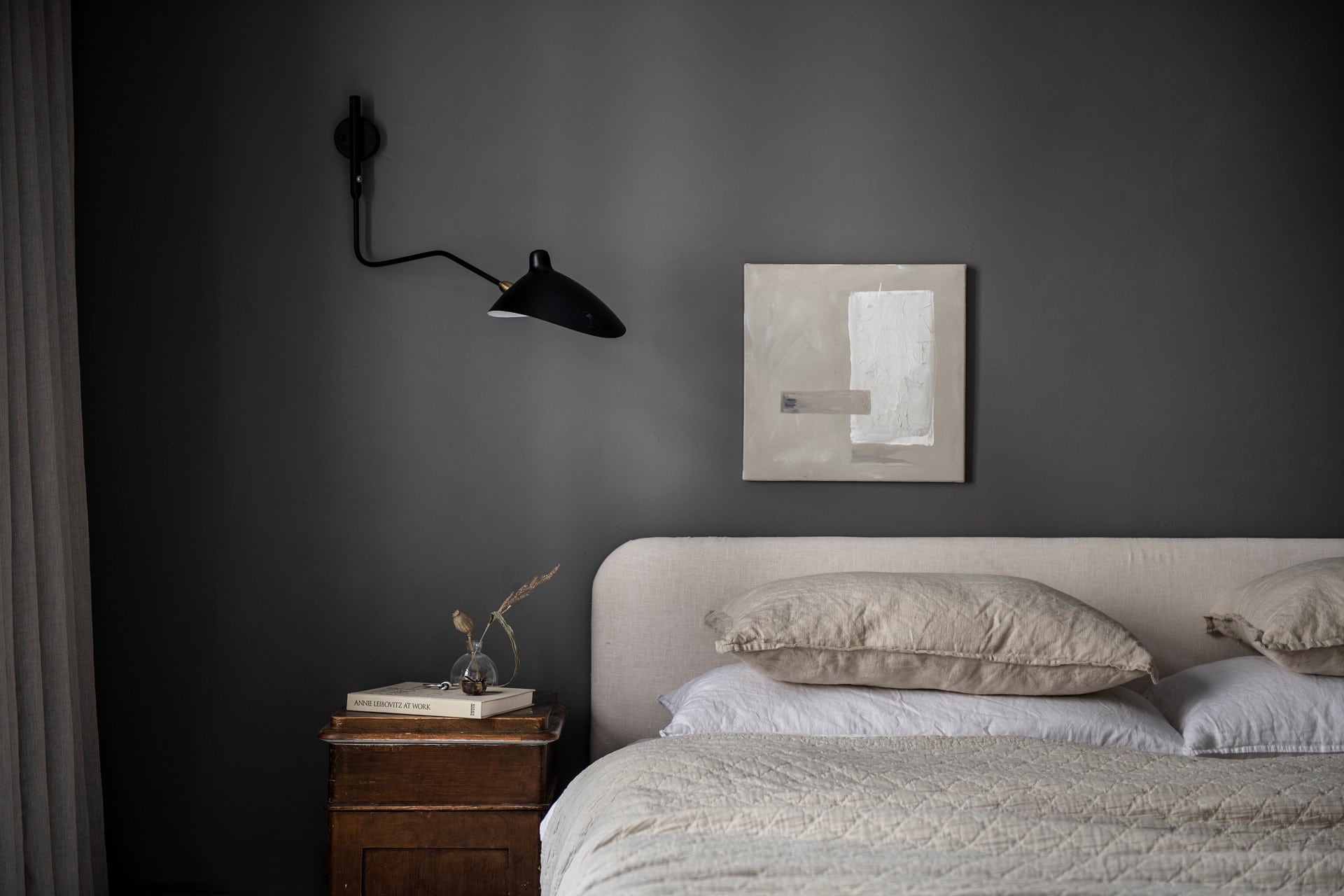 A mid-grey bedroom with warm elements